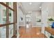 Bright foyer featuring hardwood floors and white trim leading to the rest of the home at 2522 W Watrous Ave, Tampa, FL 33629