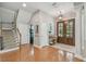 Elegant foyer with hardwood floors, staircase, and entryway with decorative double doors at 2522 W Watrous Ave, Tampa, FL 33629