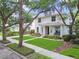 Charming two-story home with well-manicured lawn and mature trees at 2522 W Watrous Ave, Tampa, FL 33629