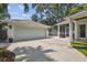 Side view of home showing the 2 car garage and access to the backyard at 2522 W Watrous Ave, Tampa, FL 33629