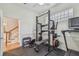 Home gym featuring weight rack, treadmill, and ample space for exercise at 2522 W Watrous Ave, Tampa, FL 33629