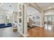 Open-concept living area featuring hardwood floors, decorative columns, and seamless transition to adjacent rooms at 2522 W Watrous Ave, Tampa, FL 33629