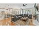 Open-concept living area with hardwood floors, fireplace, and seamless flow to the modern kitchen at 2522 W Watrous Ave, Tampa, FL 33629