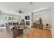 Spacious living room with hardwood floors, a fireplace, and a large sectional sofa at 2522 W Watrous Ave, Tampa, FL 33629