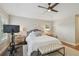 Serene main bedroom with tray ceiling, ceiling fan, and ensuite at 2522 W Watrous Ave, Tampa, FL 33629