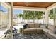 Comfortable covered outdoor patio with ceiling fan, stylish rug and view of the pool at 2522 W Watrous Ave, Tampa, FL 33629