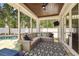 Comfortable screened patio with ceiling, television and view of the pool at 2522 W Watrous Ave, Tampa, FL 33629