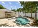 Enjoy the sunshine in your private pool area with a barbecue area and tropical landscaping at 2522 W Watrous Ave, Tampa, FL 33629
