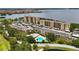Scenic aerial view of the condominium complex with pool and water views at 2616 Cove Cay Dr # 505, Clearwater, FL 33760