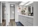 Bright bathroom featuring a large vanity with plenty of storage and stylish nautical themed decor at 2616 Cove Cay Dr # 505, Clearwater, FL 33760