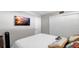 Bedroom featuring a large TV and pillows at 2616 Cove Cay Dr # 505, Clearwater, FL 33760