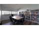 Modern conference room with table, chairs, and built-in bookshelves at 2616 Cove Cay Dr # 505, Clearwater, FL 33760