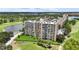 Gorgeous exterior showcasing lush lawns, serene water views, and the building's well-kept facade at 2616 Cove Cay Dr # 505, Clearwater, FL 33760