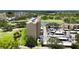 Condominium building with manicured green space, convenient parking, and serene water views at 2616 Cove Cay Dr # 505, Clearwater, FL 33760