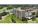 Beautifully landscaped condominium featuring lush greenery, a golf course, and scenic water views at 2616 Cove Cay Dr # 505, Clearwater, FL 33760