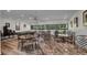Well-lit game room with chairs and table setup for an evening of enjoyment at 2616 Cove Cay Dr # 505, Clearwater, FL 33760