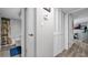 Hallway featuring a bathroom entrance, closet space, and leading to another room at 2616 Cove Cay Dr # 505, Clearwater, FL 33760