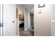 Hallway with doors to a bedroom and bathroom with neutral walls and modern flooring at 2616 Cove Cay Dr # 505, Clearwater, FL 33760