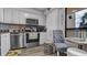 Charming kitchen features stainless steel appliances, granite countertops, and sleek white cabinetry at 2616 Cove Cay Dr # 505, Clearwater, FL 33760