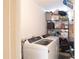 Clean laundry room with storage shelving, a washer, and a dryer at 2616 Cove Cay Dr # 505, Clearwater, FL 33760