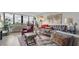 Bright living room with a large window, comfortable seating, and modern decor creates a relaxing atmosphere at 2616 Cove Cay Dr # 505, Clearwater, FL 33760