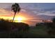 Spectacular sunrise view over a golf course and bridge in the distance at 2616 Cove Cay Dr # 505, Clearwater, FL 33760
