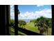 Beautiful view of a golf course and waterfront from a window at 2616 Cove Cay Dr # 505, Clearwater, FL 33760