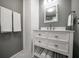Bathroom featuring a vanity, a bright mirror, and crisp white towels and hexagonal tile flooring at 310 N Lincoln Ave, Clearwater, FL 33755