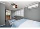 Comfortable bedroom featuring a ceiling fan, mini-split AC, and access to other rooms at 310 N Lincoln Ave, Clearwater, FL 33755