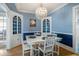 Dining room with chandelier, white furniture, and decorative trim at 310 N Lincoln Ave, Clearwater, FL 33755