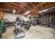 This is a detached garage with exposed wooden beams, lighting and space for motorcycles and workshop equipment at 310 N Lincoln Ave, Clearwater, FL 33755