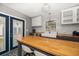 Bright kitchen showcases white subway tile backsplash, butcher block counters, and custom center island at 310 N Lincoln Ave, Clearwater, FL 33755