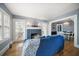 Elegant living room featuring a fireplace, hardwood floors, and French doors at 310 N Lincoln Ave, Clearwater, FL 33755