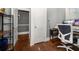 Office space featuring hardwood floors, shelves, and a computer desk at 310 N Lincoln Ave, Clearwater, FL 33755