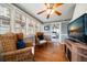 Cozy sunroom filled with natural light from multiple windows and hardwood floors at 310 N Lincoln Ave, Clearwater, FL 33755