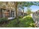 A spacious backyard with a screened in porch for relaxing and enjoying nature with privacy fence at 31215 Flannery Ct, Wesley Chapel, FL 33543