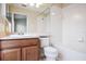 Bathroom showcasing a vanity with a white sink, toilet, and tiled shower/tub combination, offering a clean and functional space at 31215 Flannery Ct, Wesley Chapel, FL 33543