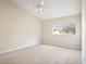 Large bedroom with vaulted ceiling, ceiling fan, and window, creating a welcoming space at 31215 Flannery Ct, Wesley Chapel, FL 33543