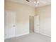 Neutral bedroom with a ceiling fan, two closets, and view to another room at 31215 Flannery Ct, Wesley Chapel, FL 33543