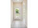 Bright entryway with tile flooring and an arched doorway at 31215 Flannery Ct, Wesley Chapel, FL 33543