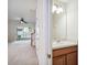 A convenient half bathroom off the foyer with a mirror and vanity for guests at 31215 Flannery Ct, Wesley Chapel, FL 33543