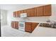 Well-lit kitchen with lots of counter space and white appliances at 31215 Flannery Ct, Wesley Chapel, FL 33543