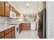 Kitchen showcasing stainless steel appliances and generous counter space at 31215 Flannery Ct, Wesley Chapel, FL 33543