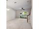Spacious living room with a ceiling fan and sliding glass doors at 31215 Flannery Ct, Wesley Chapel, FL 33543