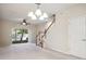 Cozy living room offering staircase access to the upper level at 31215 Flannery Ct, Wesley Chapel, FL 33543