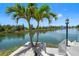 Waterfront backyard features a private dock and lush landscaping along the canal at 3397 Bluefish Dr, Hernando Beach, FL 34607