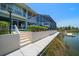 Backyard features a screened-in pool area and a dock, providing direct access to the water at 3397 Bluefish Dr, Hernando Beach, FL 34607