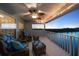 Scenic balcony with comfortable seating and picturesque views of the water at sunset at 3397 Bluefish Dr, Hernando Beach, FL 34607