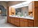 Well-lit bathroom features double vanity, quartz countertops, and ample storage in wood cabinetry at 3397 Bluefish Dr, Hernando Beach, FL 34607