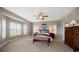 Spacious main bedroom features large windows, ceiling fan, neutral decor and a seating bench at 3397 Bluefish Dr, Hernando Beach, FL 34607